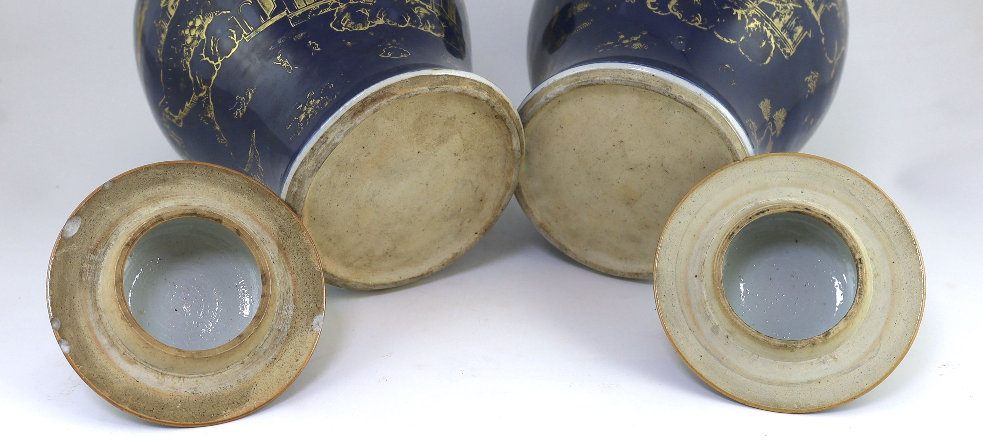 A pair of Chinese gilt-decorated blue ground baluster vases and covers, 19th century, 44 cm high